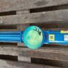 A blue Fludyn BE2H progressive cavity pump without motor, mounted crosswise on a wooden pallet. The openings are closed with yellow caps 